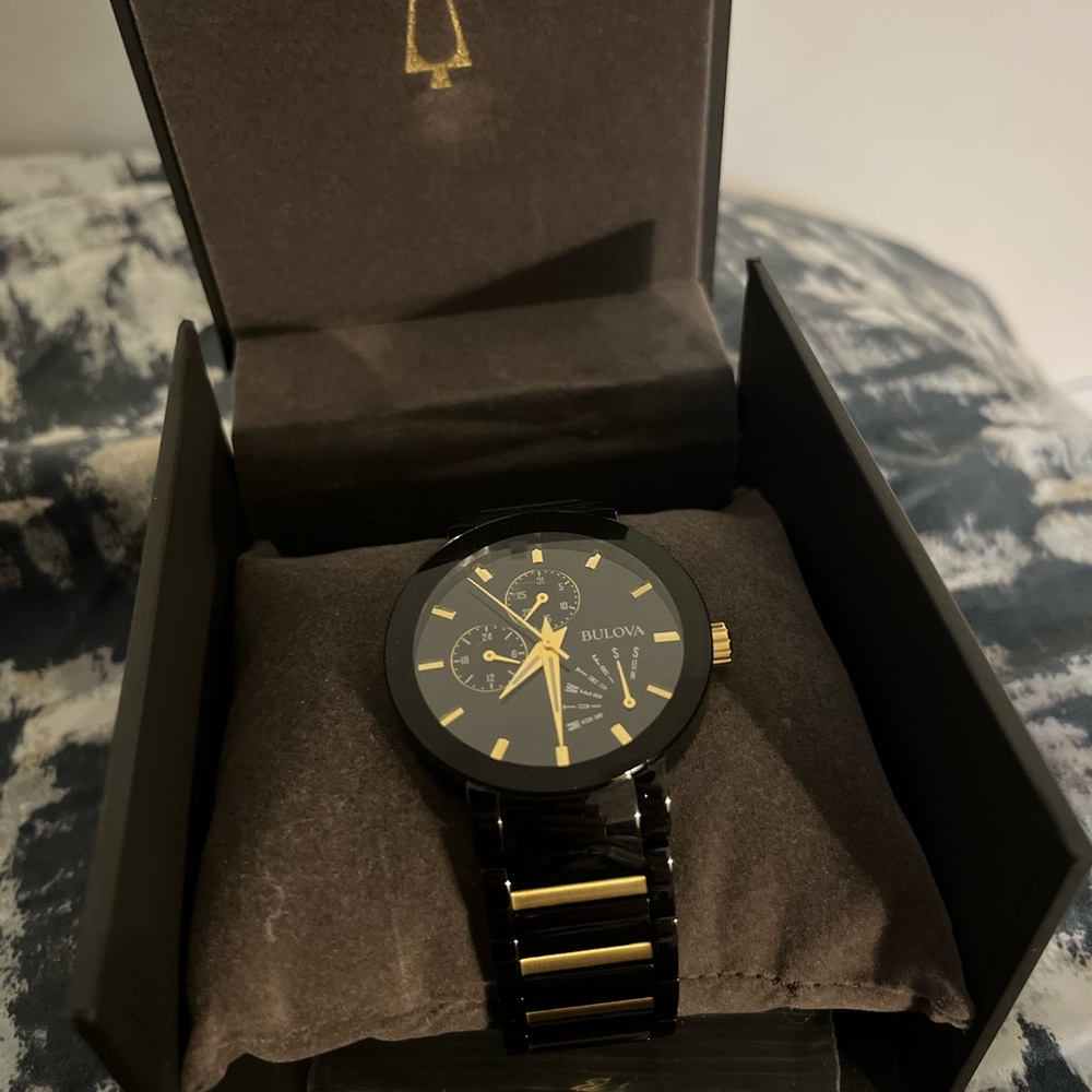 Bulova gold and black watch